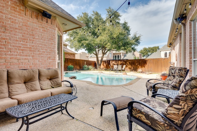 view of swimming pool with an outdoor hangout area and a patio