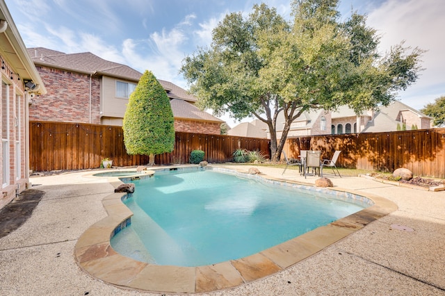 view of pool featuring a patio