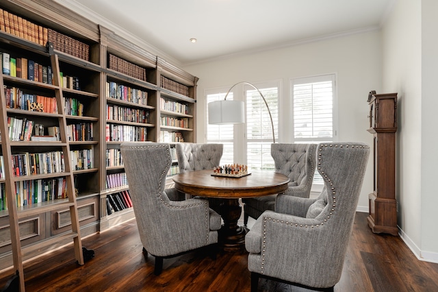 sitting room with dark wood-type flooring and ornamental molding