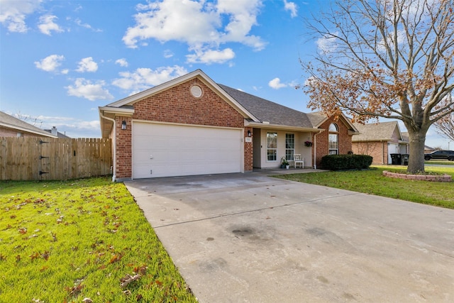 ranch-style home featuring a garage and a front yard