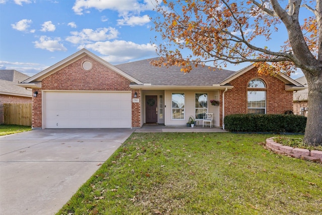 ranch-style home with a front yard, a porch, and a garage