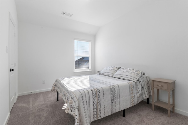 carpeted bedroom featuring vaulted ceiling