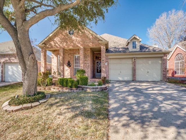 view of front of property with a front yard and a garage