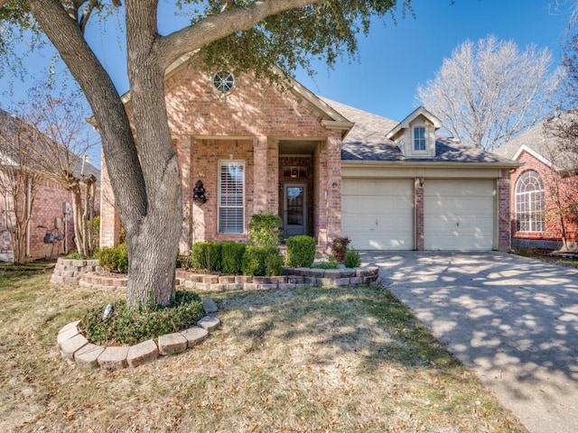 view of front of home with a garage and a front yard