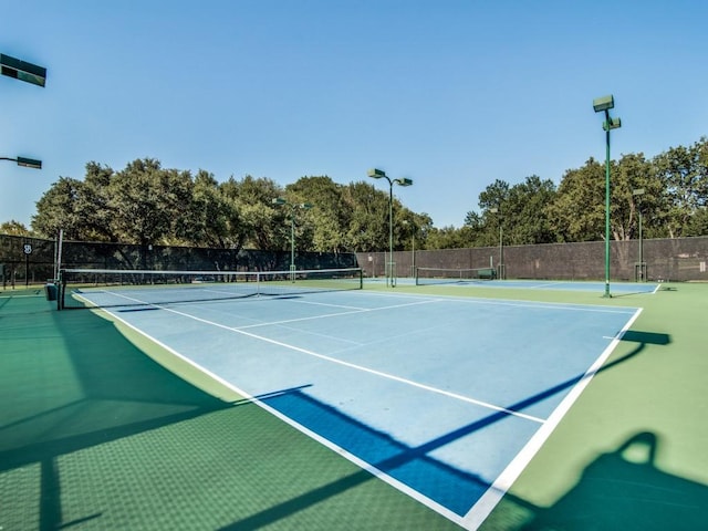 view of sport court featuring basketball hoop