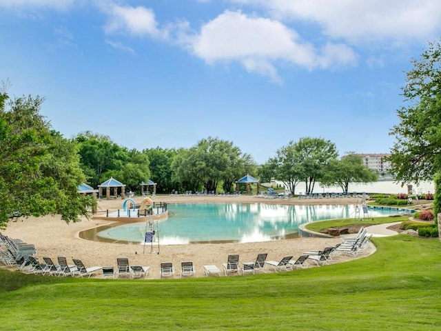 view of pool featuring a yard