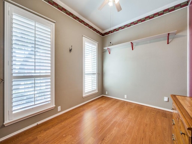 spare room with ceiling fan, ornamental molding, and light hardwood / wood-style flooring