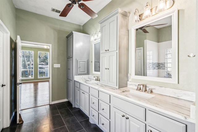 bathroom featuring ceiling fan and vanity