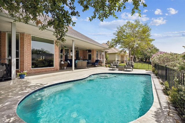 view of pool featuring an outdoor living space and a patio