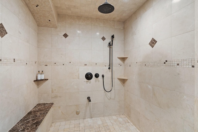 bathroom with tiled shower