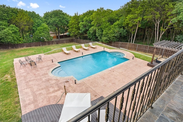 view of pool with a lawn and a patio area