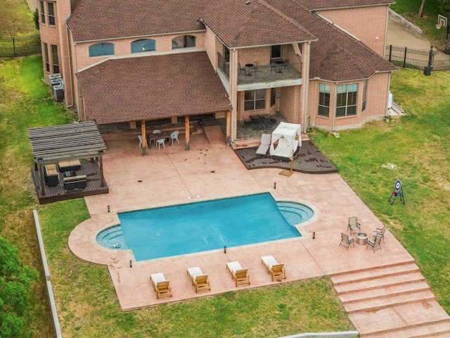 view of swimming pool with a lawn and a patio area