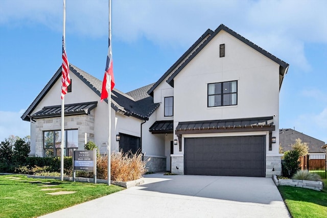 view of front of house with a front yard and a garage