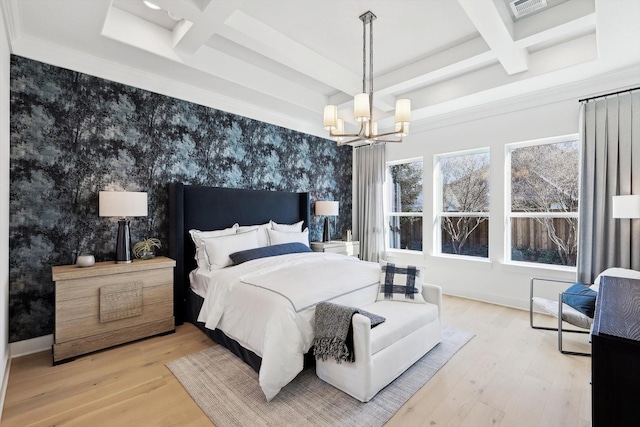 bedroom featuring beamed ceiling, hardwood / wood-style flooring, coffered ceiling, and a notable chandelier