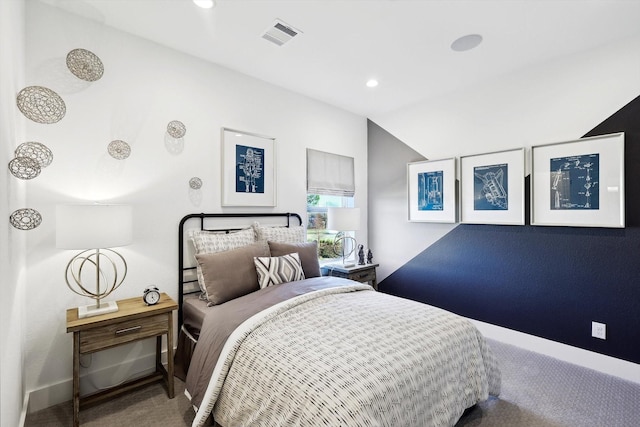 carpeted bedroom with vaulted ceiling