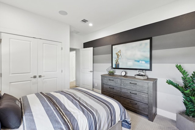 carpeted bedroom featuring a closet