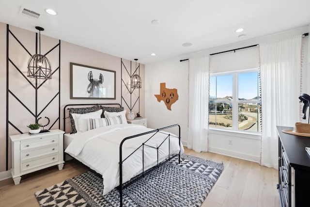 bedroom featuring light hardwood / wood-style floors