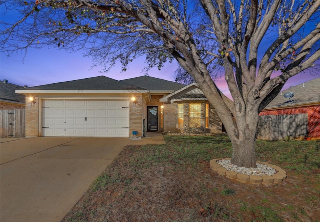 ranch-style home with a garage