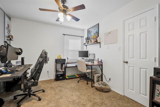 carpeted office with ceiling fan