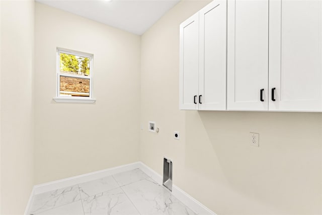 clothes washing area featuring electric dryer hookup, washer hookup, and cabinets