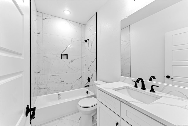 full bathroom with tiled shower / bath, vanity, and toilet