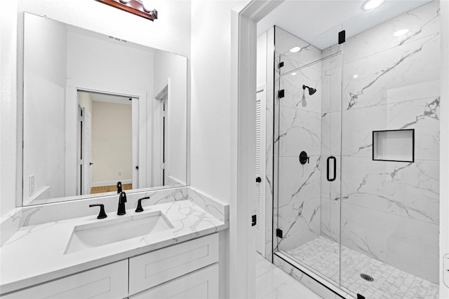 bathroom with vanity and an enclosed shower