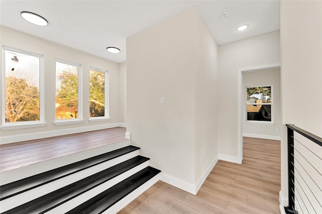 stairs featuring hardwood / wood-style flooring