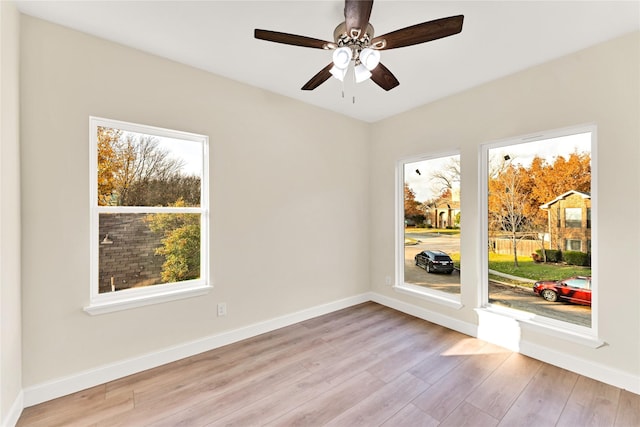 unfurnished room featuring ceiling fan and light wood-type flooring