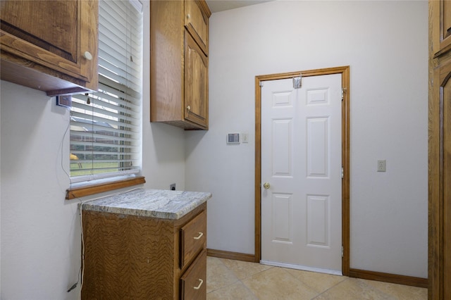 clothes washing area featuring cabinets and electric dryer hookup