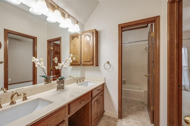 bathroom featuring vanity, lofted ceiling, and independent shower and bath