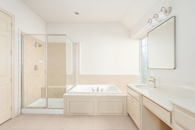 bathroom with tile patterned flooring, shower with separate bathtub, vanity, and vaulted ceiling