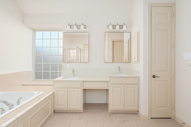 bathroom featuring tile patterned flooring, shower with separate bathtub, and vanity