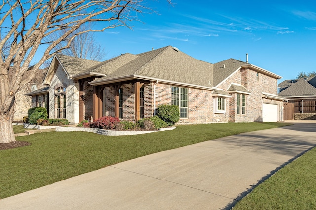 view of front facade featuring a front lawn and a garage