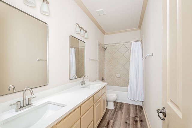 full bathroom with hardwood / wood-style floors, vanity, crown molding, toilet, and shower / tub combo with curtain