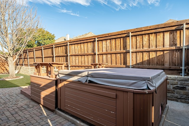 view of patio with a hot tub