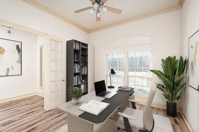 home office with french doors, light hardwood / wood-style floors, ceiling fan, and crown molding