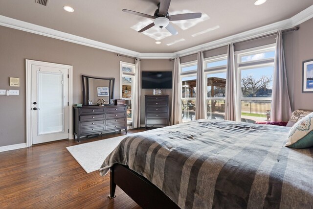 bedroom with dark hardwood / wood-style flooring, ceiling fan, and crown molding