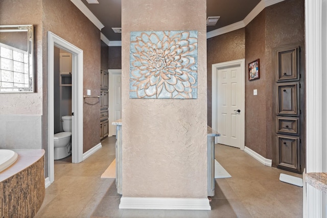 bathroom featuring toilet, tile patterned flooring, ornamental molding, and tiled tub