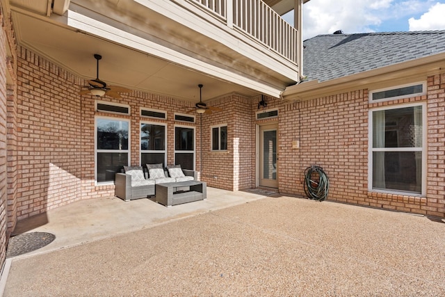 view of patio / terrace with a balcony, ceiling fan, and an outdoor hangout area