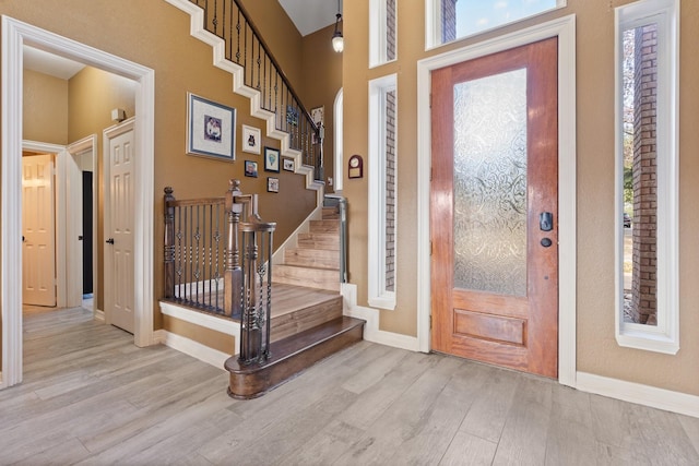 foyer entrance with light wood-type flooring