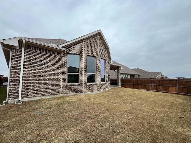 5529 Mountain Island Dr, Fort Worth, TX 76179 - rear view of house with a lawn