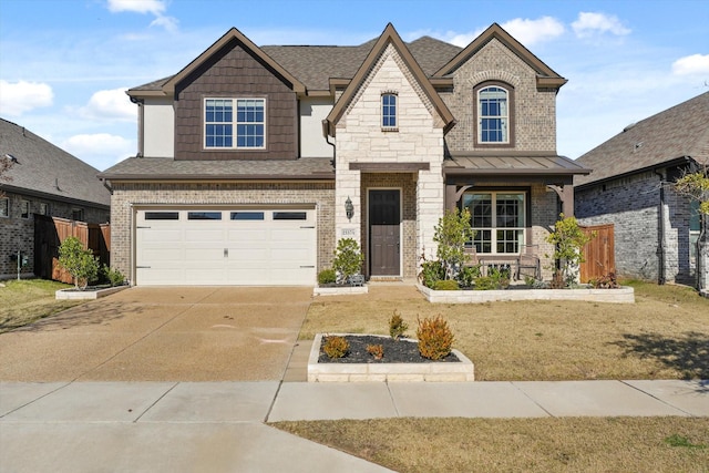 view of front of property with a garage and a front lawn