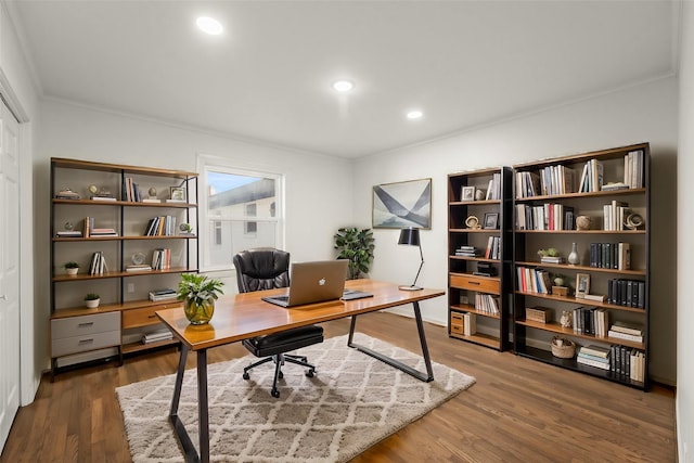 office area featuring dark hardwood / wood-style floors and ornamental molding