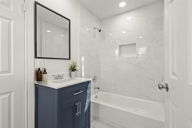 bathroom featuring vanity and tiled shower / bath combo