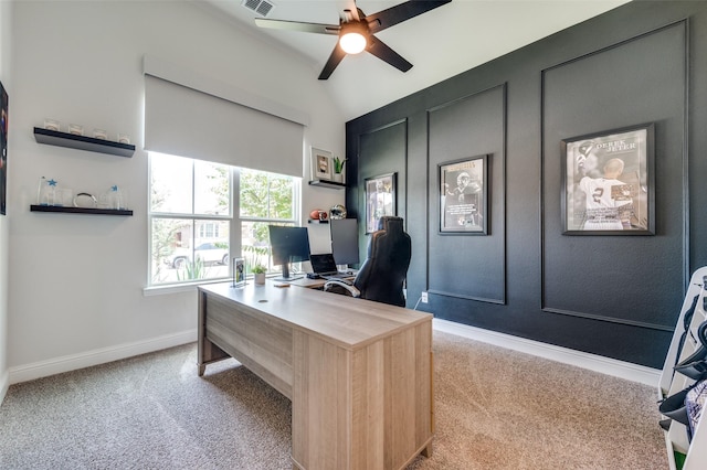 carpeted office featuring ceiling fan and vaulted ceiling