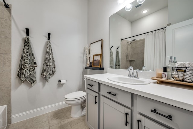 bathroom featuring tile patterned floors, vanity, and toilet