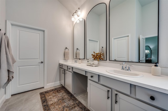 bathroom with tile patterned flooring, vanity, and lofted ceiling