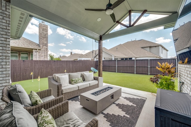 view of patio with a gazebo, ceiling fan, and an outdoor living space with a fire pit