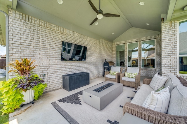 view of patio / terrace featuring ceiling fan, area for grilling, and an outdoor living space with a fire pit