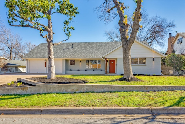 single story home featuring a front lawn and a garage